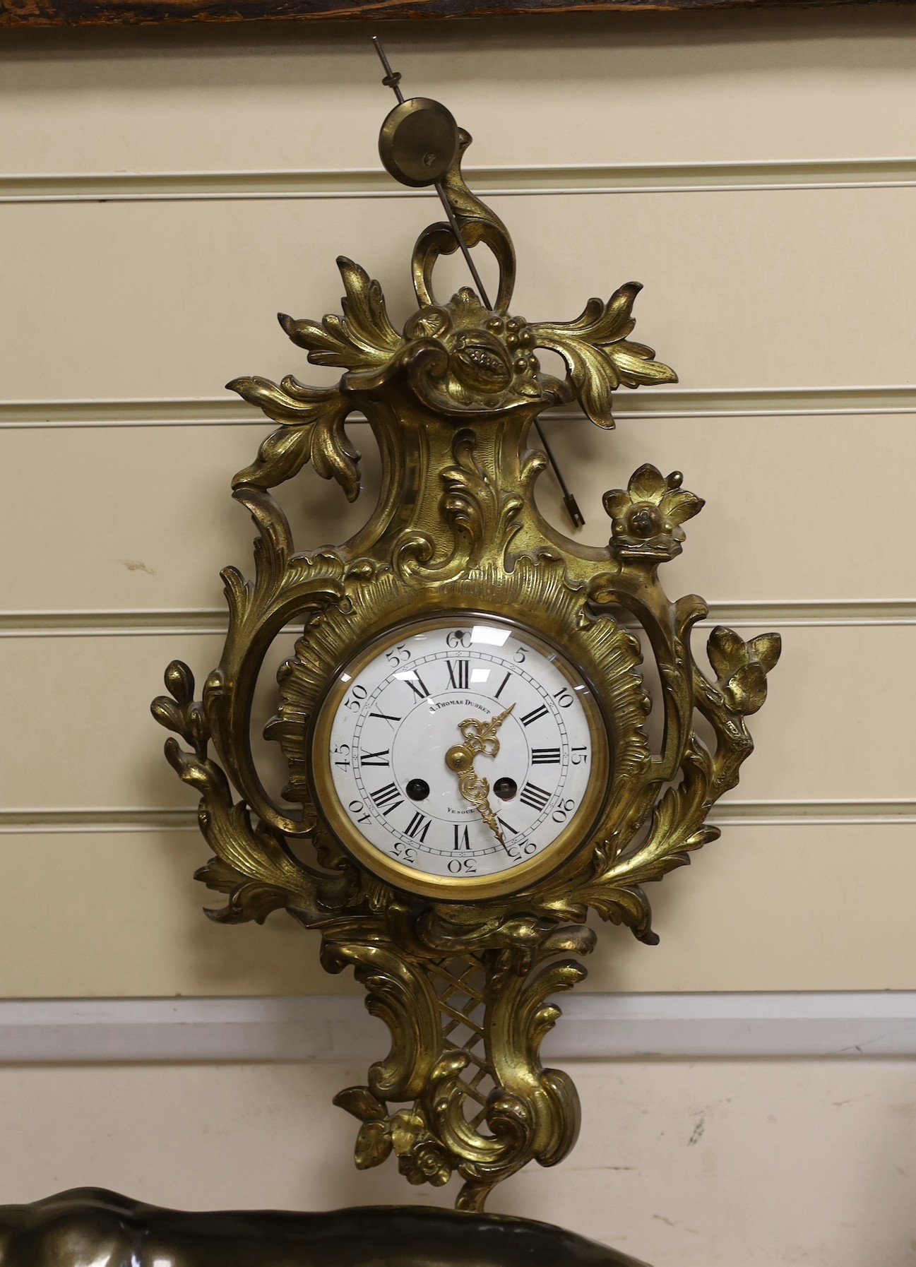 A 19th century French ormolu cartel wall clock, by A Thomas Dubret, 53cms high